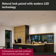 Modern white LED recessed lights in ceiling with contemporary oak and matte aluminium kitchen design