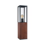 Modern outdoor lamp with wooden base and black metal frame, clear glass shade, visible bulb design