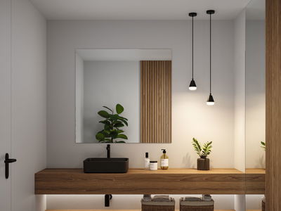 Modern bathroom with black sink, wooden shelf, and two black pendant lights providing ambient lighting