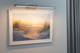 Slim brushed aluminum LED picture light in silver for wall art and paintings, modern lighting solution.
