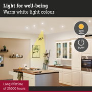 Modern kitchen illuminated by warm white LED ceiling lights promoting well-being and durability