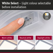 Finger adjusting light colour on white plastic switch, LED ceiling light with selectable colour temperature