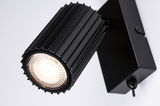 Black aluminum LED wall light with ribbed housing and warm white light for modern interior lighting