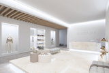 Modern boutique interior with white marble, wooden ceiling, and minimalist lighting showcasing fashion and accessories