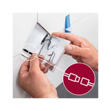 Hands connecting LED light cable with plug connector in white wall mount for LED lighting setup