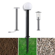 Three modern outdoor metal lamps in black and grey with different designs for garden and terrace lighting
