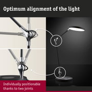 Black LED desk lamp with adjustable joint and chrome metal arm for flexible lighting and positioning