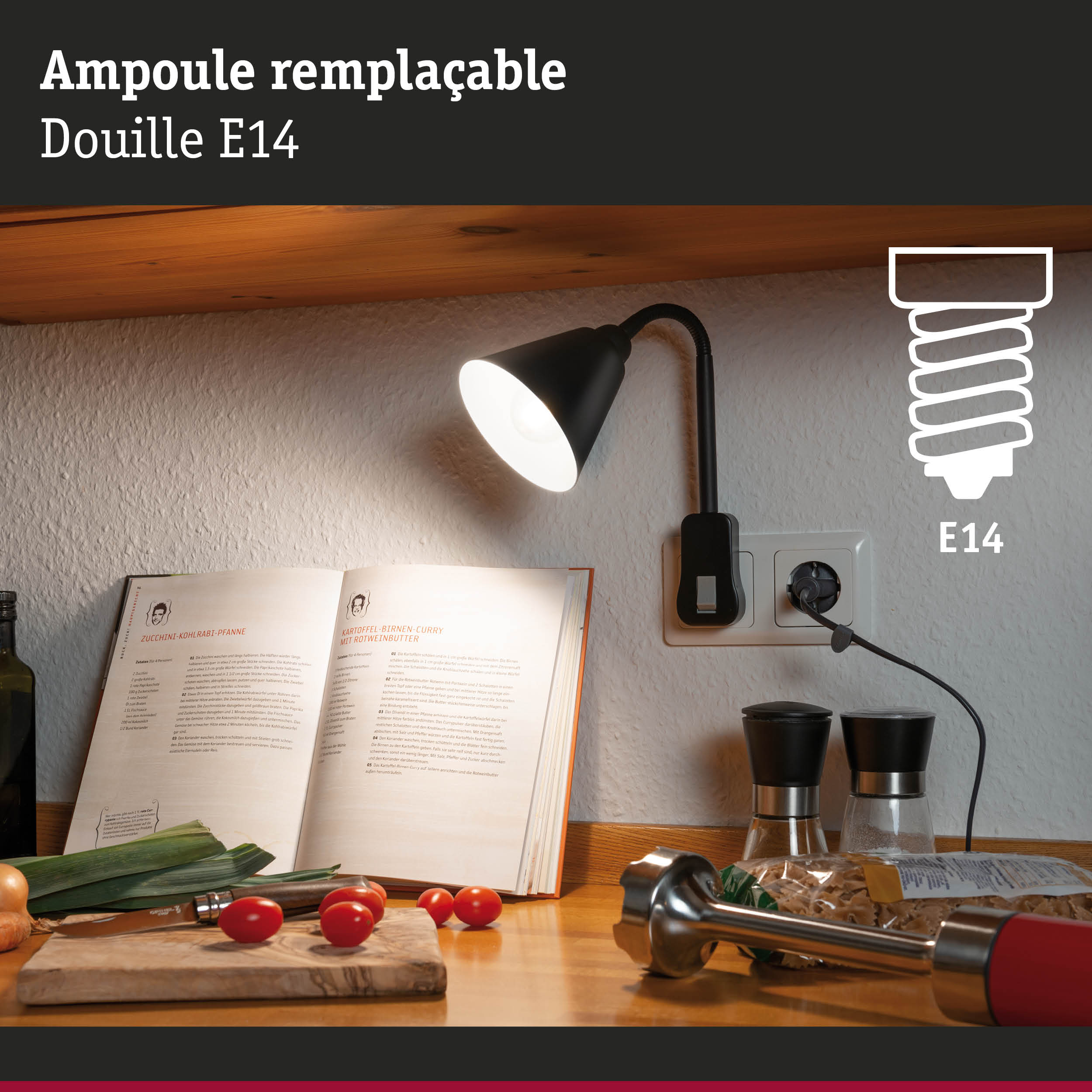 Lampe de lecture noire avec ampoule E14 remplaçable éclairant un livre de cuisine et un plan de travail