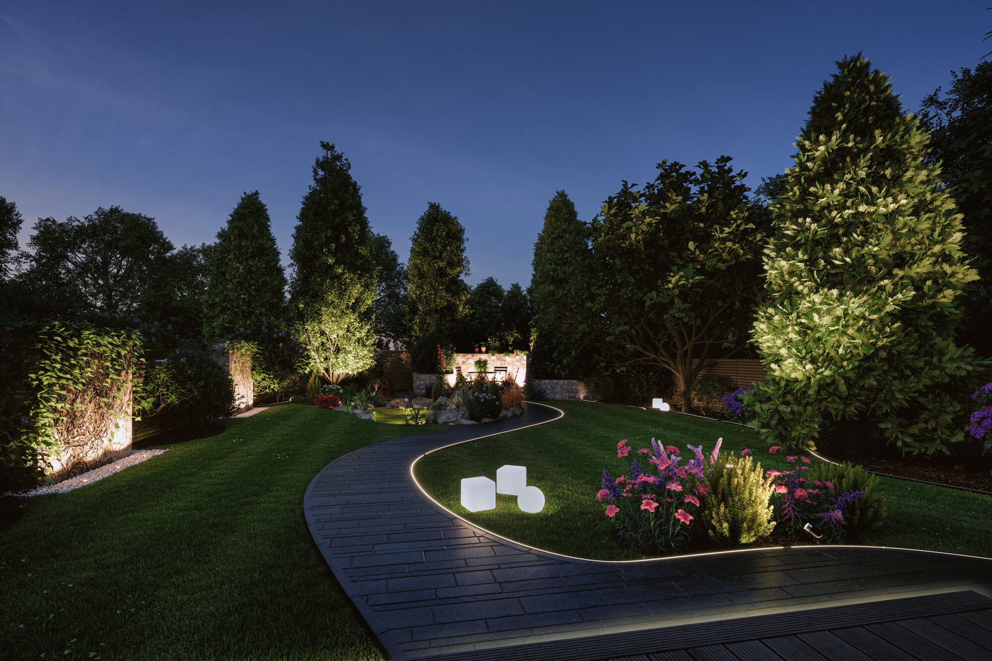 Illuminated garden path with LED recessed lights and decorative garden lamps at night
