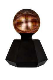 Black table lamp with spherical perforated shade glowing warm orange, modern decorative lighting