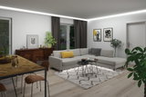 Modernes Wohnzimmer mit grauem Ecksofa, hellem Teppich und indirekter LED-Deckenbeleuchtung für gemütliche Atmosphäre