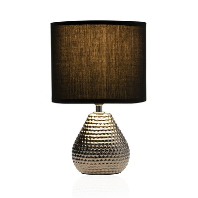 Table lamp with textured gold metal base and black fabric shade for stylish home lighting