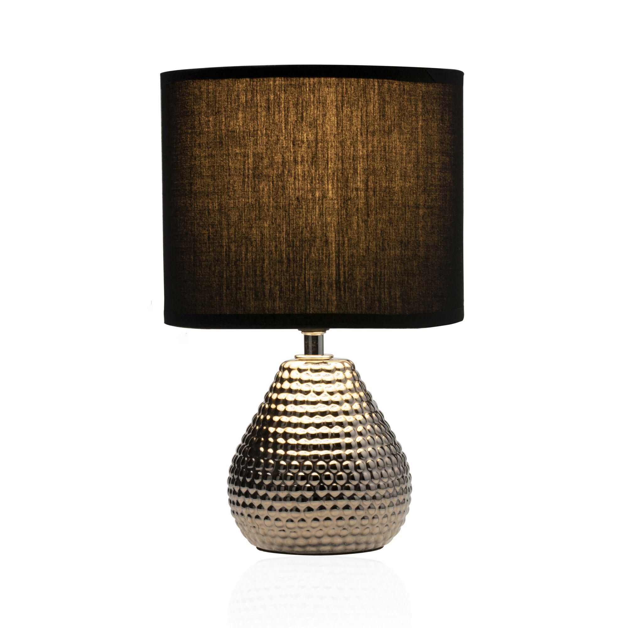Table lamp with black fabric shade and gold textured ceramic base for stylish home lighting