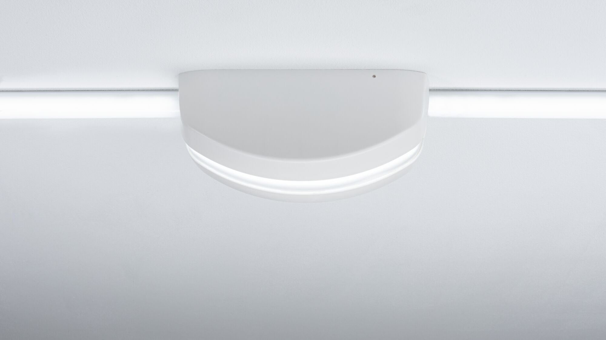 Semi-circular white LED ceiling light made of plastic with integrated light strip for modern interiors