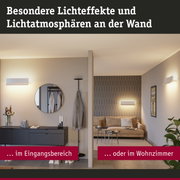 Moderner Wohnbereich mit weißen Wandlampen und warmem Licht für besondere Lichteffekte und Atmosphäre