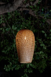Hanging lamp made of woven natural material in brown with warm light for garden lighting