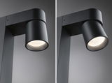 Modern black metal LED outdoor spotlight with cylindrical design for garden lighting