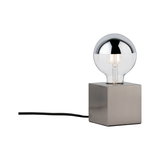 Modern table lamp with square stainless steel base and clear bulb featuring silver top cap for stylish lighting