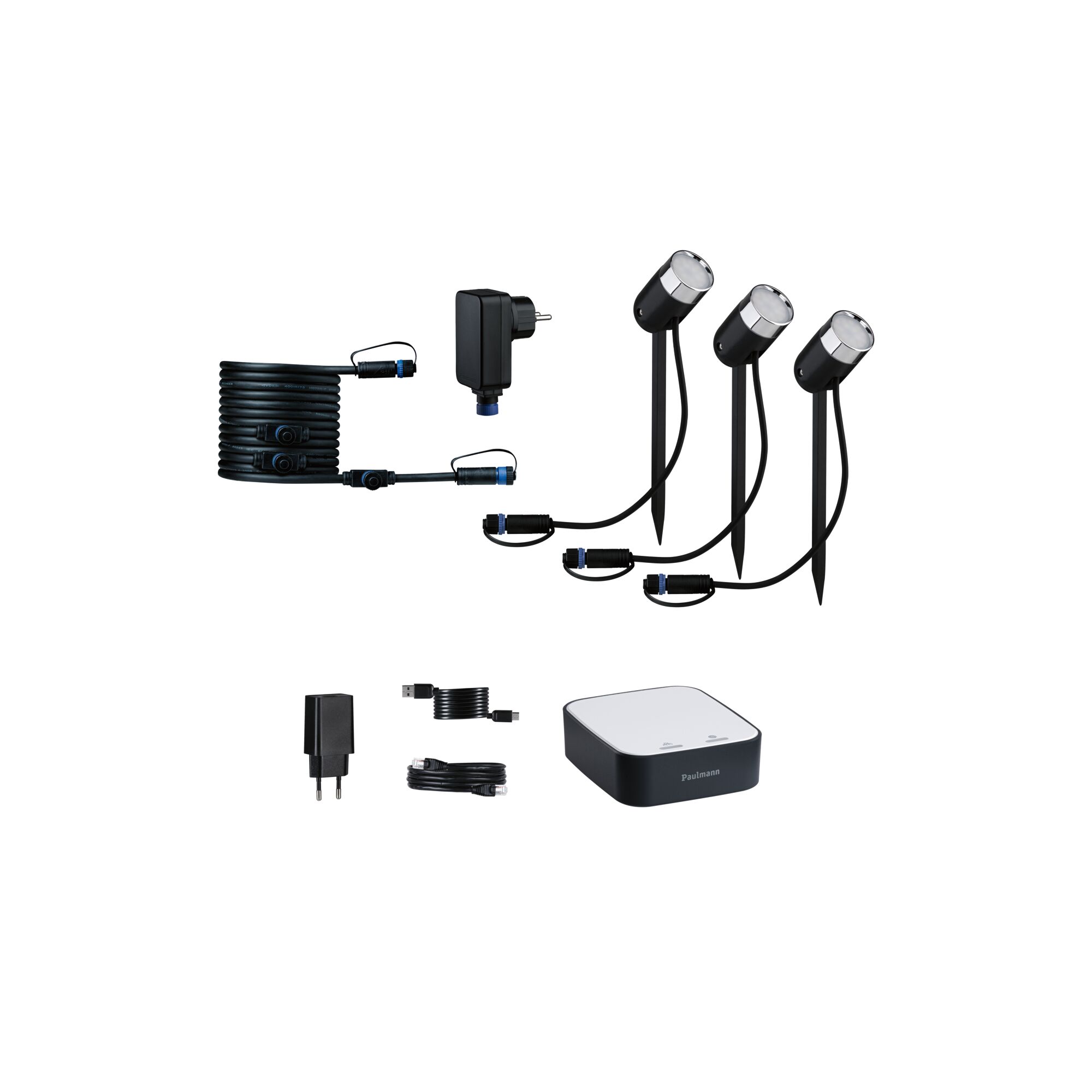 Zwarte LED-tuinschijnwerper set met drie lampen, kabels en besturingseenheid voor buitenverlichting.