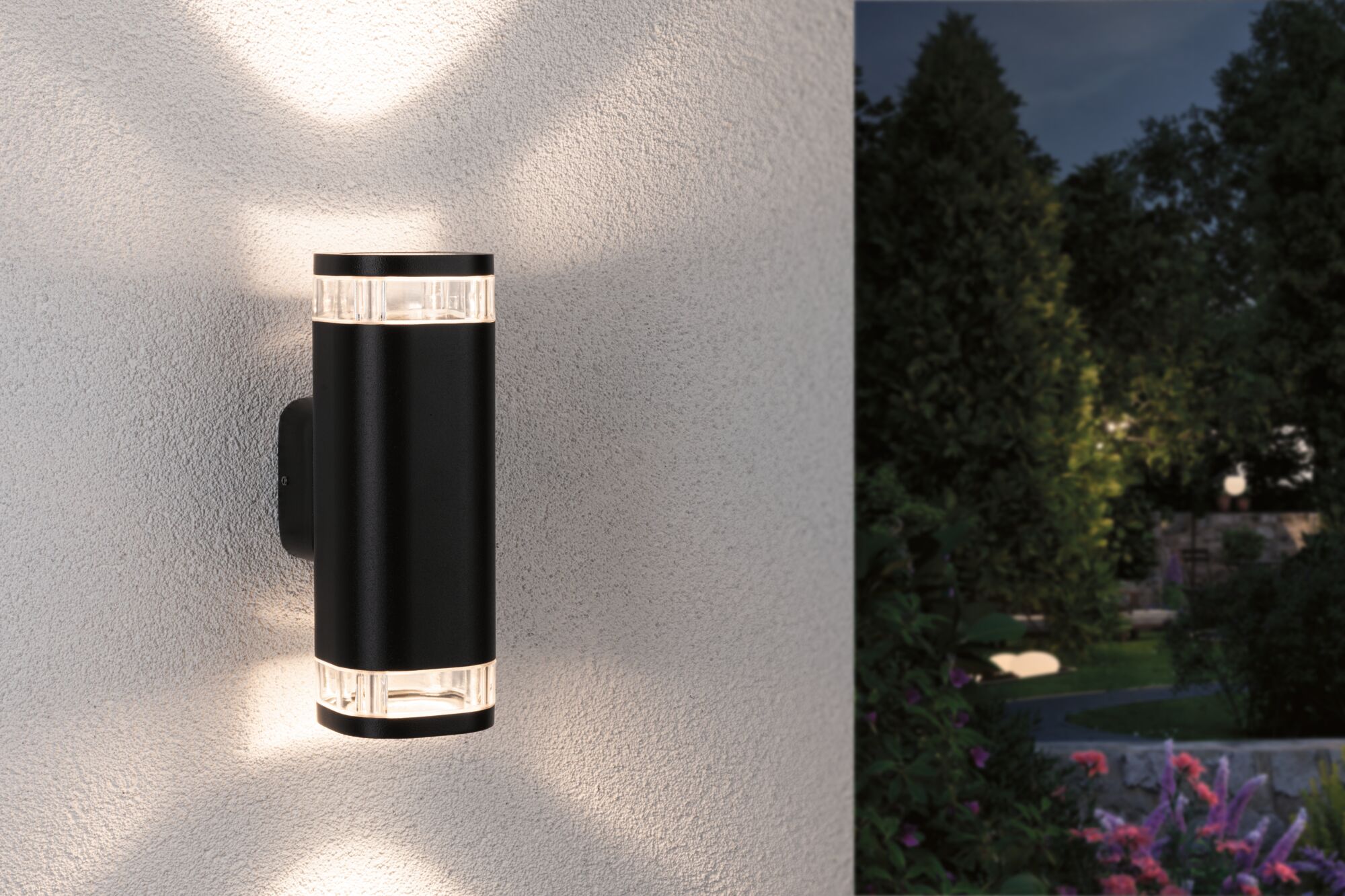 Black aluminum wall light with warm white LED for outdoor and garden lighting solutions.
