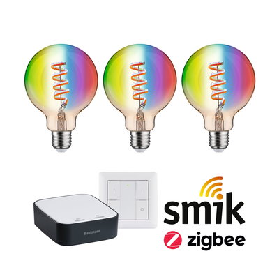 Trois ampoules LED colorées avec filament en spirale, commande domotique et interrupteur mural Zigbee.