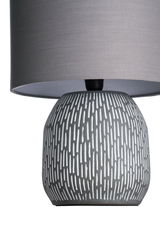 Gray ceramic table lamp base with white pattern and gray fabric shade for home lighting