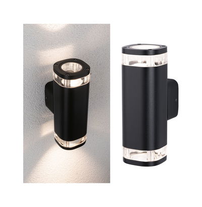 Black aluminum outdoor wall light with clear acrylic sections and up-down lighting for garden illumination