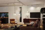 Modern living room with brown leather furniture and white Paulmann pendant lights for warm ambient lighting