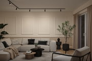 Modernes Wohnzimmer mit beigem Ecksofa, schwarzen Akzenten und minimalistischer Deckenbeleuchtung