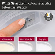 Finger adjusting White Select Light colour before installation showing warm, neutral, and daylight LED options