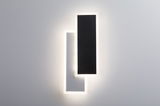 Modern LED wall light with two overlapping rectangular panels in black and white, indirect lighting effect