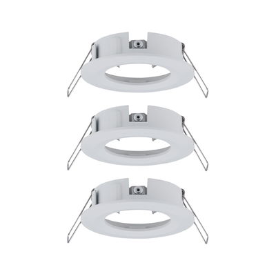 Three white plastic recessed frames with metal springs for LED ceiling lights installation.