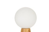 Round white glass lamp on light wooden base, modern table light for living spaces
