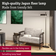 Modern Jagun floor lamp in black metal with felt cover and swivelling lamp head in living room