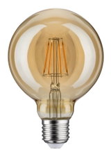 Rund LED-pære med ravfarvet glas og synlige filamenter til dekorativ belysning