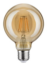 Round LED bulb with amber glass and visible filaments for decorative lighting and warm ambiance