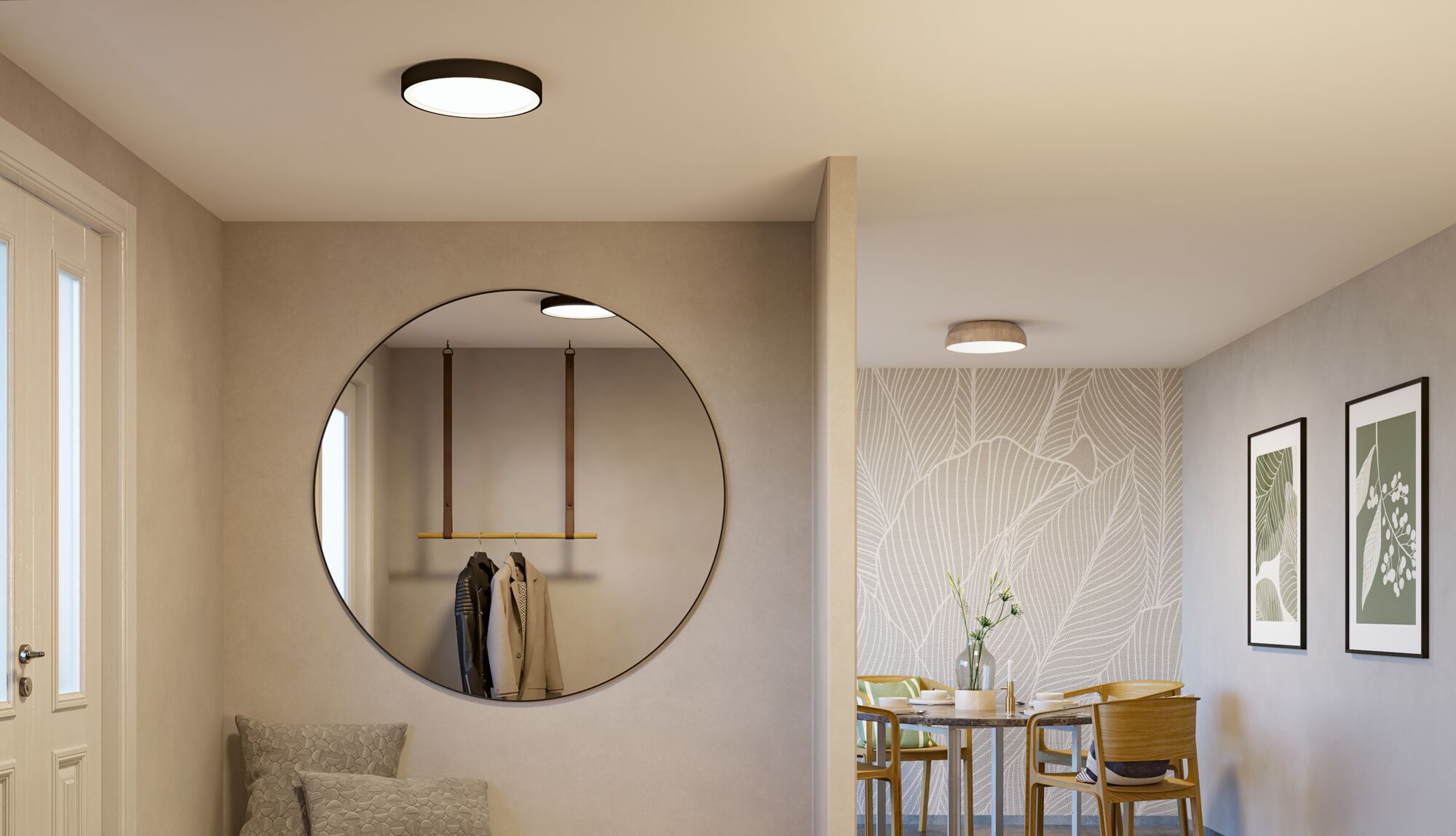 Modern living room with black round ceiling light, wooden dining table, and decorative framed leaf prints