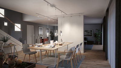 Salle à manger moderne avec table en bois, chaises grises et blanches, et suspensions en verre transparent