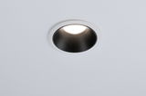 Round recessed light with white frame and black reflector for modern LED ceiling lighting