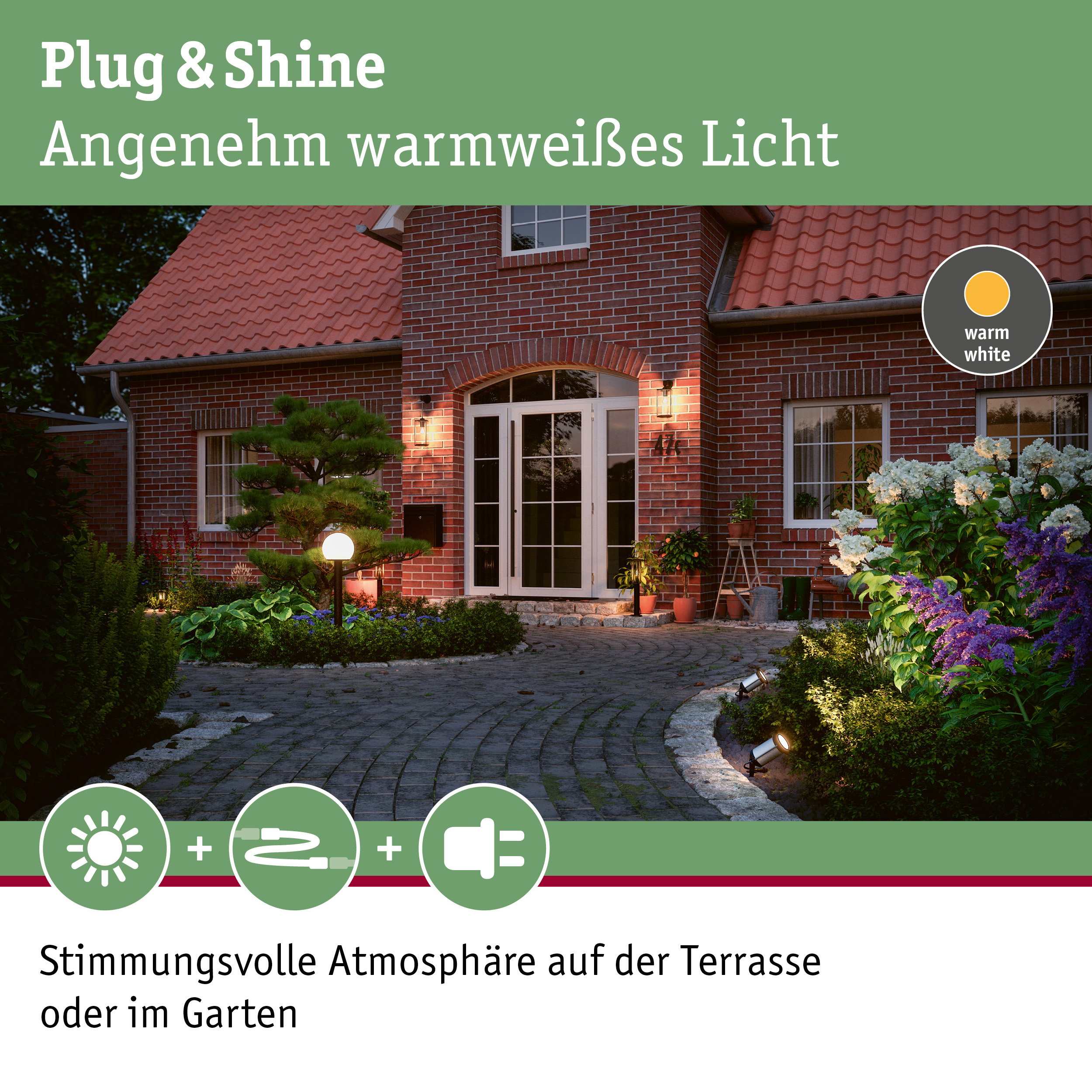 Rotes Backsteinhaus mit warmweiß beleuchteter Terrasse und Gartenbeleuchtung für Außenbereich