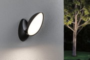Schwarze LED-Wandleuchte mit ovalem, weißem Leuchtpanel an grauer Außenwand für Gartenbeleuchtung