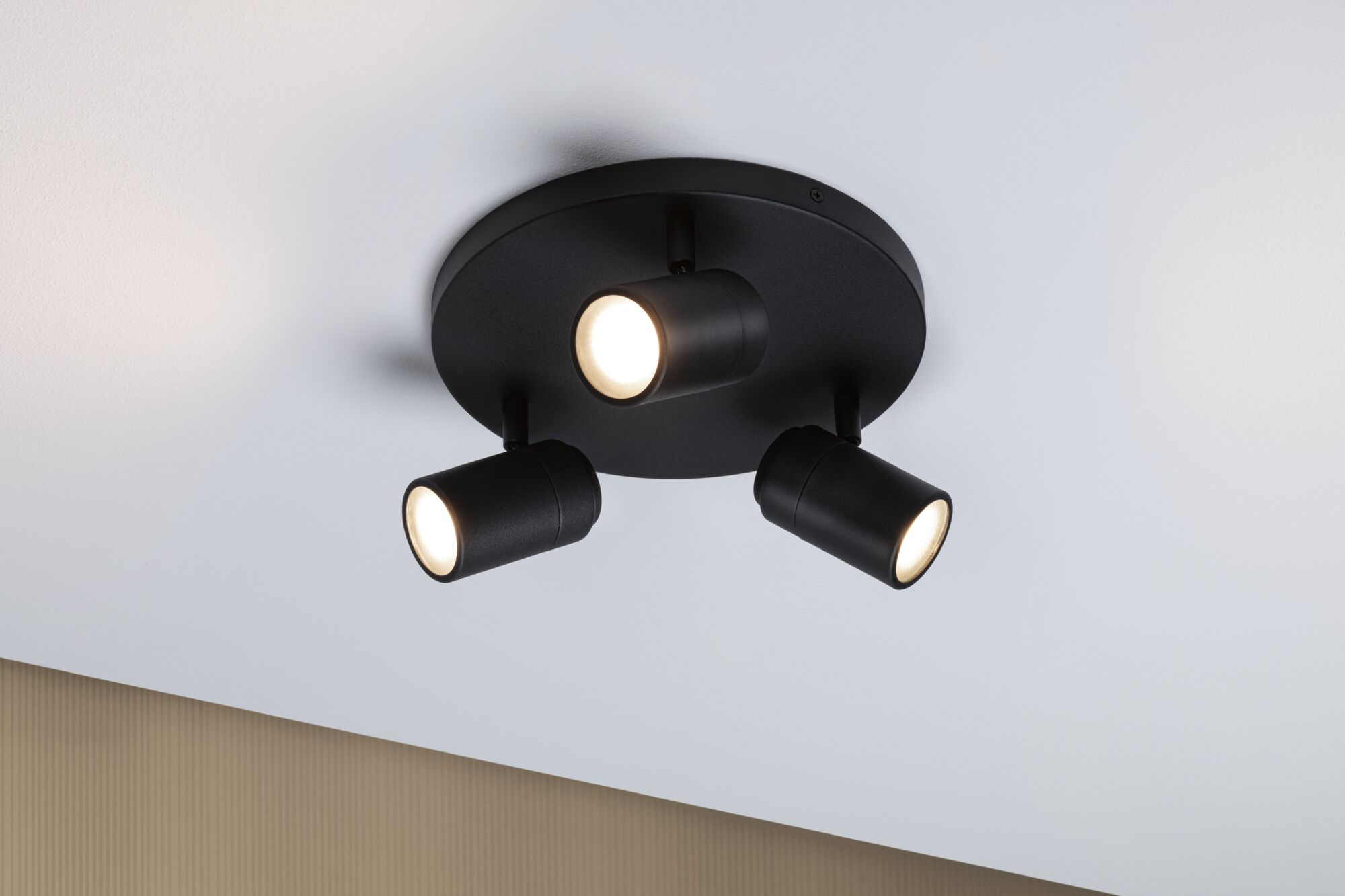 Black ceiling light with three adjustable LED spotlights for modern room lighting