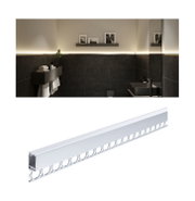 White aluminium LED profile for indirect lighting in modern bathroom with black tiled walls