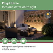 Cozy terrace illuminated by warm white Plug & Shine LED light for atmospheric garden lighting