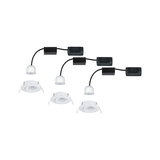 Three white LED recessed spotlights with black cables and connectors for flexible ceiling lighting