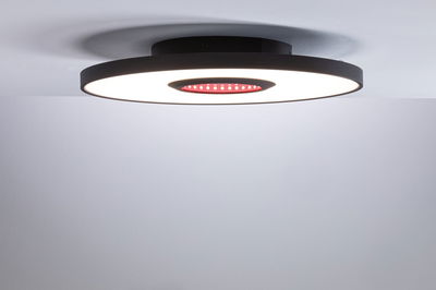 Modern black LED ceiling light with round design and red accent for stylish room lighting