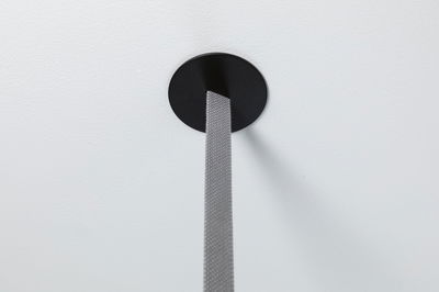 Black round ceiling mount with grey textile cable for modern LED pendant light.