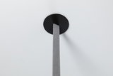 Black round ceiling mount with grey textile cable for modern LED pendant light.