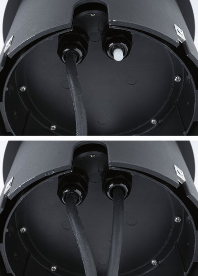 Close-up of black plastic housing with cable glands for LED lighting installation