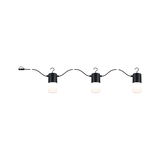 Three black LED lights with white diffusers on flexible cable for modern indoor lighting